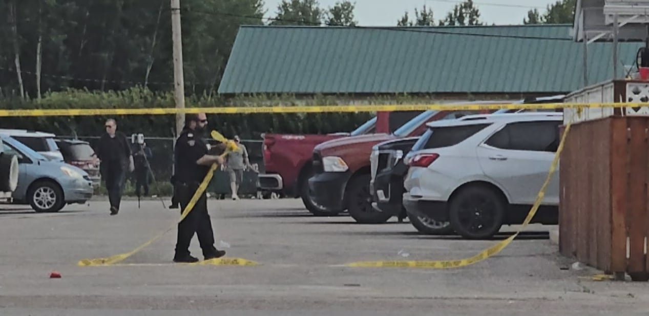 Police clean up crime scene tape outside Dirty O'Fergies bar. Three people were injured in a shooting early on Saturday morning.