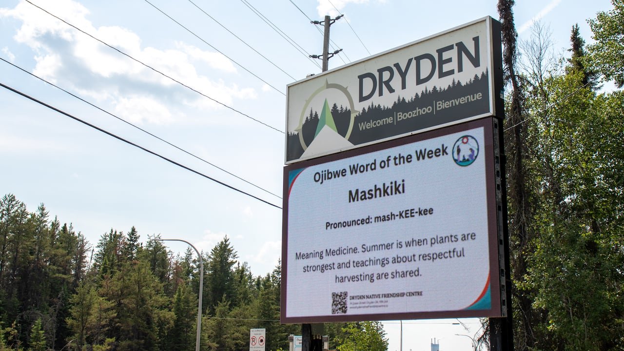 A close-up of a sign that says 'Dryden.'